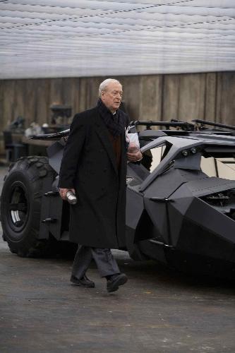 MICHAEL CAINE stars as Alfred - Alfred and the Bat Mobile.