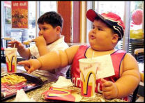 2 obese children eating out - 2 obese children eating out at a famous fast food restaurant