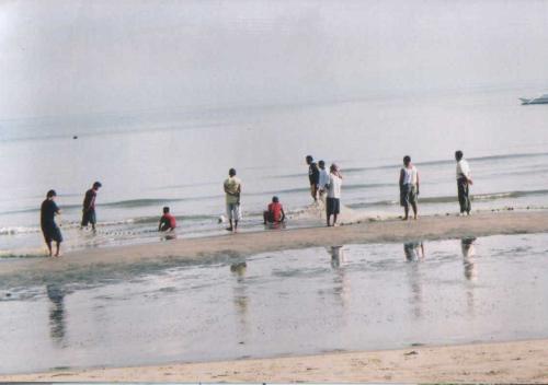 Cagayan de Oro - beach - morning beach at cagayan de oro, fishermen pulling the net to check for fish