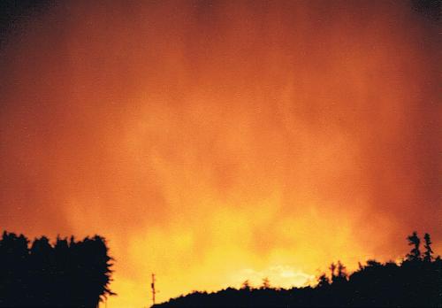 A blazing sunset - This sunset was taken in Jellicoe, Ontario, after a thunderstorm. It sort of looks like a forest fire.