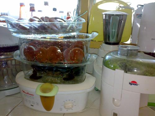 seafoods in my steamer. - on the bottom layer is a crab which is more than a kilo. the two other containers have scallops. My husband did the marketing, I did the cooking.