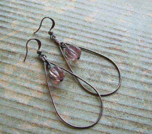 Background ideas - A simple sheet of scrapbooking paper gave this pair of earrings a vintage look.