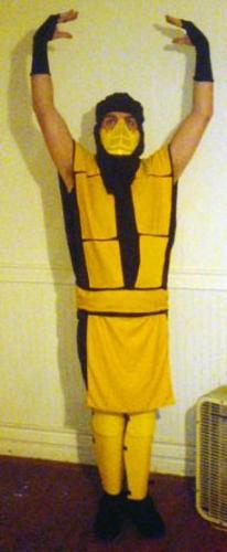 Scorpion - This is Matt as Scorpion from Mortal Kombat. I used all knit fabrics and the shin guards are cardboard covered in fabric and the face mask is an old paintball mask. I used interfacing in the shoulder pieces to make it stay up better though you can't tell in this photo