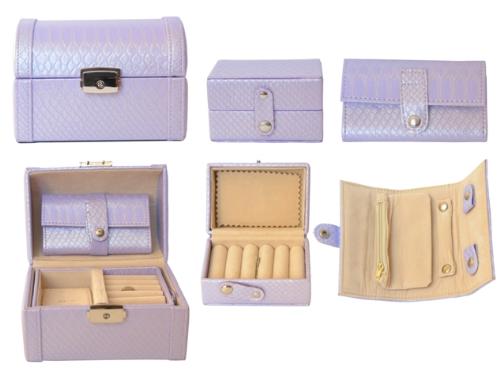 Jewellery Box - Several leather-made, light-coloured jewellery boxes with different compartments and slots.