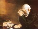 daily bread - a priest praying and giving thanks for the bread