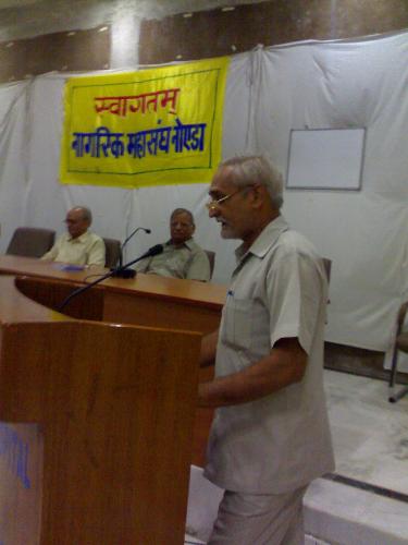 My father's pic - This is my father's pic, Actually he is announcing in a cultural fest the Topic was Todays Modern life and the Hinduism. Actually he is Prof in Delhi Univ. of the subject Modern Phylosophy. He is very nice person.I love him very much.