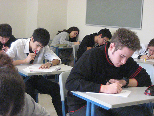 Giving best responses... - A photo of students sitting for an examination. Photo source: http://farm1.static.flickr.com/123/359572656_51a00dc2a6.jpg?v=0 .