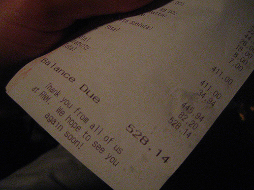 Bill please? Or pay at cashier? - Picture of a receipt. Photo source: http://farm1.static.flickr.com/192/502879630_e17c6e4355.jpg?v=0 .