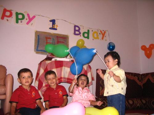 Small Children - Khalifa Tarik T. Farjani celebrates his first birthday with cousins (twins) and big brother, Sami Tarik.