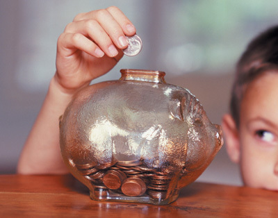 Saving money in piggy bank - Saving money in piggy bank, save earnings, extra cash through savings.