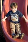 A child on sliding board - A picture of a child playing.