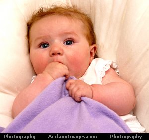 Beautiful baby girl - A thumb sucking baby!