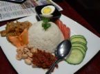 Nasi lemak - Nasi lemak serves with cucumber, anchovies, boiled egg, peanuts and spicy sambal