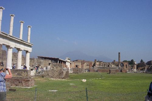 Mount Vesuvius from Pompeii - If you look in the background, you can see Mt. Vesuvius there. It's a little hazy around the mountain but we are in Pompeii and it's amazing that a mountain that seems so far away could have destroyed this city.