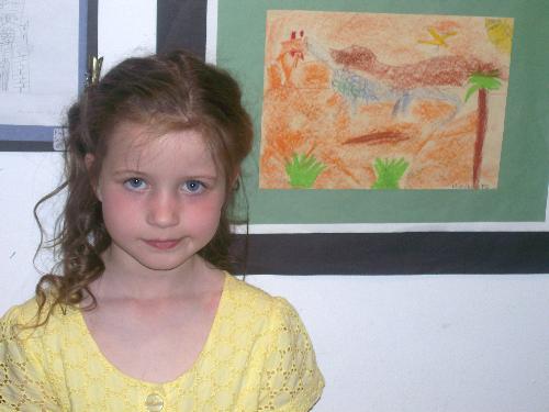 Niamh with her exhibition picture! - Niamh was delighted to be invited to the opening of a regional schools art exhibition when her picture was selected to be shown