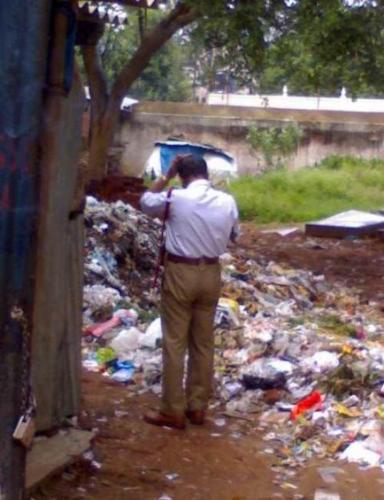 Cop peeing on garbage! - Can you stoop lower than this?!