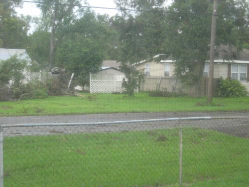 Neighbor across the street - debris and fence down (hurricane gustav)