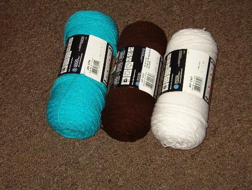 Colors of My Next Crochet Project -  I know these colors don't exactly look great in the skeins, but I'm hoping they'll make a nice afghan. Chocolate brown and turqoise are hot colors in decorating right now.