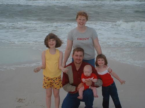 me and my hubby and kids - taken on panama city beach , before the hurricane hit , it was the one before katrina I think
