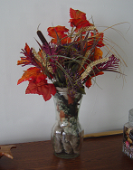 Hiding silk flower stems - I used a glove to hide the stems and it looks very nice, at least to me. You might want to use one of your winter gloves, or a bunch of old ribbon or even tissue paper to hide the stems of your silk flowers if you don&#039;t have an opaque vase. 
