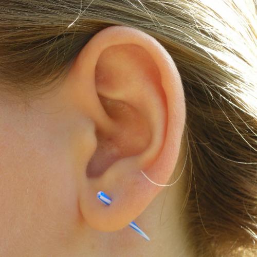 Stretching Ear Using a Taper - Going from a 14 guage to a 12 guage here.