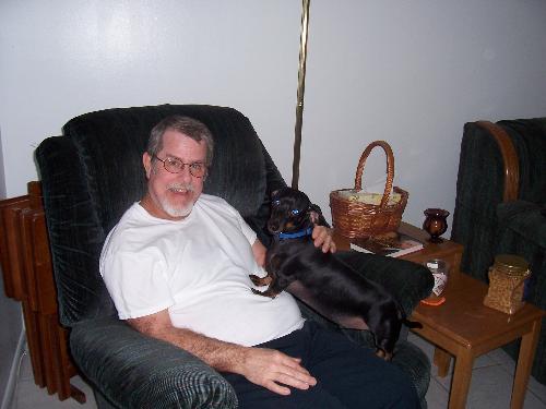 Husband Dennis and my baby boy Bogie - One of the rare times Bogie gets to sit in Daddy's lap. Bogie adored his Daddy.