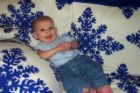 A child on a blanket - A photo of a small child on a blanket.