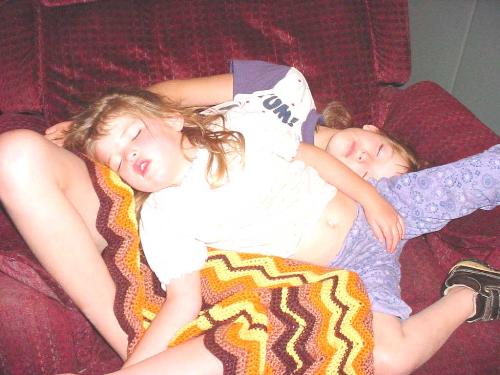 Sisters all arms and legs - My granddaughters Tamzi and Sister Alzera sleeping in a jumbled pile of arms and legs after playing hard.