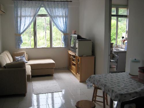 My comfortable clean living room plus dining area - Window view over looks a hill full of greens with a small river below.