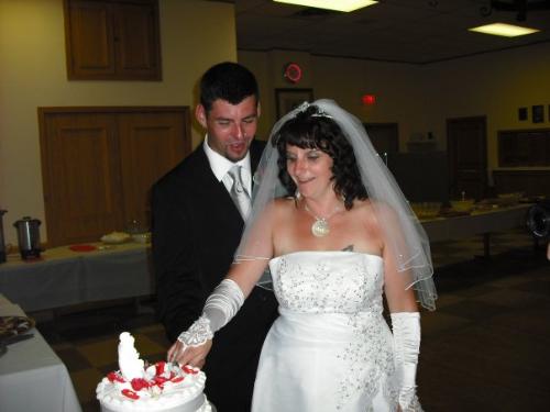Our Wedding - Us cutting the cake.