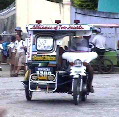 Three wheeled vehicle in Philippines - This is three wheeled vehicle in my country and it is called tricycle.