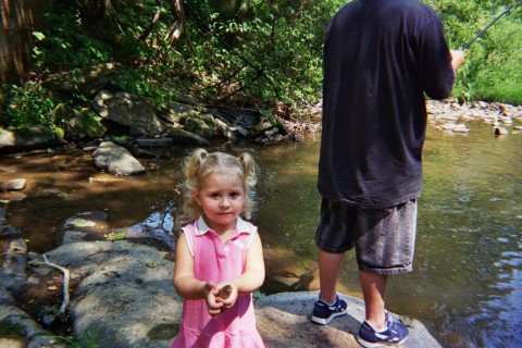 Kiana - Kiana fishing for the first time with daddy. God I love this picture. She was so proud of her little fish. Her and dad took it and let it lose in the pond in my grandparents back yard.