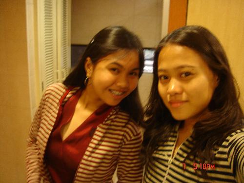 My Bestfriend and I - This is a picture of me and my best friend taken last year. We were going to watch an orchestra play. We've been friends since second grade and we're now in college. We try to keep in touch despite our busy schedules. :) She's in red and I am in blue. We wore matching striped jackets that time. :)