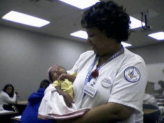 nursing school - My new granddaughter makes a visit to school. Nurse of the future makes her entrance to school. Just a tad bit too early to start school.