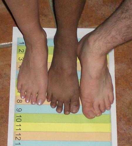 Three feet standing on a mat - Three feet standing on a mat. The mat is coloured