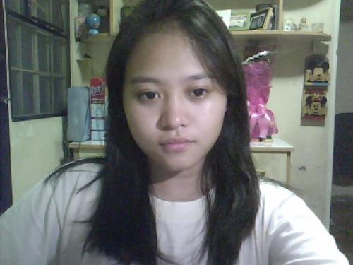 This is me with my current 'do. - I am wondering if I should cut it not so short.. With bangs then the back part would look like it has uneven stylish cuts. I dunno what you call it. My hair grows long fast. Naturally, it was short before and now it's this long. I want to try a new style. I want short with bangs but stylish and would look good on me. I don't want my face to look big though. Maybe having bangs with short hair would decrease the size of my face. :) I dunno. I am not so good with styling.. So help me up. :)