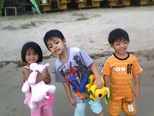 miguel with twin gabby and clarisse at the beach - the three kids enjoy their stay at the beach after playing in the sand