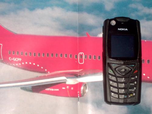 phones in the air - cellphone and airliner photo..