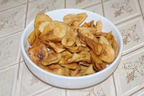 saba bananas - banana chips in a bowl. Sweet, light and crunchy. Great for snacks.