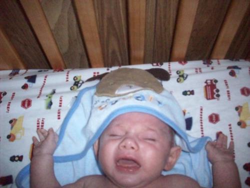Bryan Doesnt Like Water - I had just given my 2 1/2 month old son Bryan a bath, and he cried all thru it, and was really really mad afterwards, as you can tell.