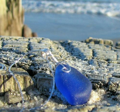 Cobalt Sea Glass Necklace - One of my favorite shots. This one was captured at the beach in NJ in December. It was cloudy, so very cold and windy and for the briefest minute, the clouds parted enough for the sun to shine strongly and the wind stopped enough to let me stop shaking and I captured this shot. It was one of my images that went into a book called 'Handbook for Handmade' and is now my avatar on Etsy.com. The piece itself sold earlier this year