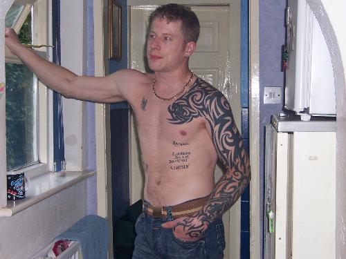 I think he likes the pain! - This tattoo has been done over a long period of time, and he is not done yet he wants to take this one up his neck!