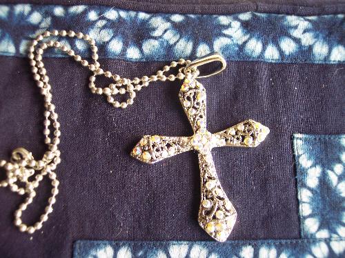 A Cross Necklace - The cross represents the cross where Jesus was crucified. He died for our sins. He arose from the grave to show he truly is the son of God. Believe in Him, and you will have everlasting LIFE!!