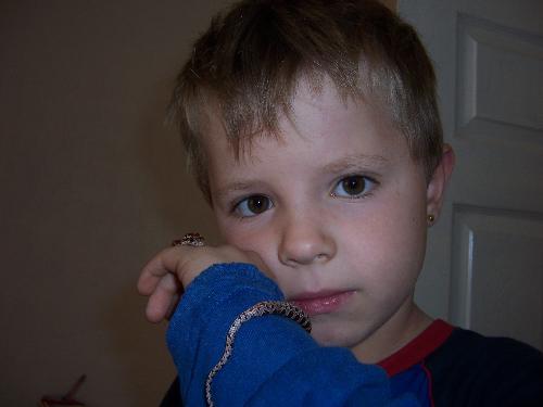This is my son with Leila Cornsnake! - We share the care of the snake between us but you can see how friendly she is with people.