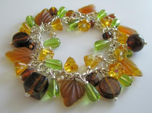 Autumn Splendor Bracelet - My newest Etsy.com listing!  This bracelet is a wonderful collection of autumn colors. Amber-brown glass leaves dance among leafy green teardrops, amber bellflower cups and an assortment of deep brown glass beads. The bracelet is 7 1/2' in length, silver plated and finished with a lobster clasp.