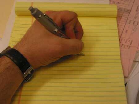 Left-handed writer - This is a picture that illustrates the left handed writer