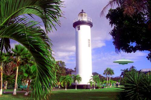 Rincon Puerto Rico  - This is a photo of the light house in Rincon Puerto Rico. Rincon PR is a magnet for surfers during the winter. Rincon welcomes all visitors. At VillaOrleansPR.com we get visitors from everywhere.