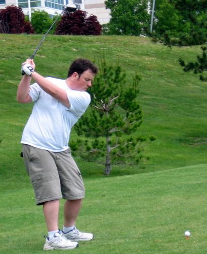 Golfing - My husband golfing at the local driving range