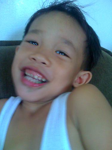 Eyes beaming with laughter - See how happy he is, his eyes were the windows to his feelings.