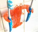 Lobster Toothbrush Holder - A whimsical little lobster toothbrush holder, doing his jo.